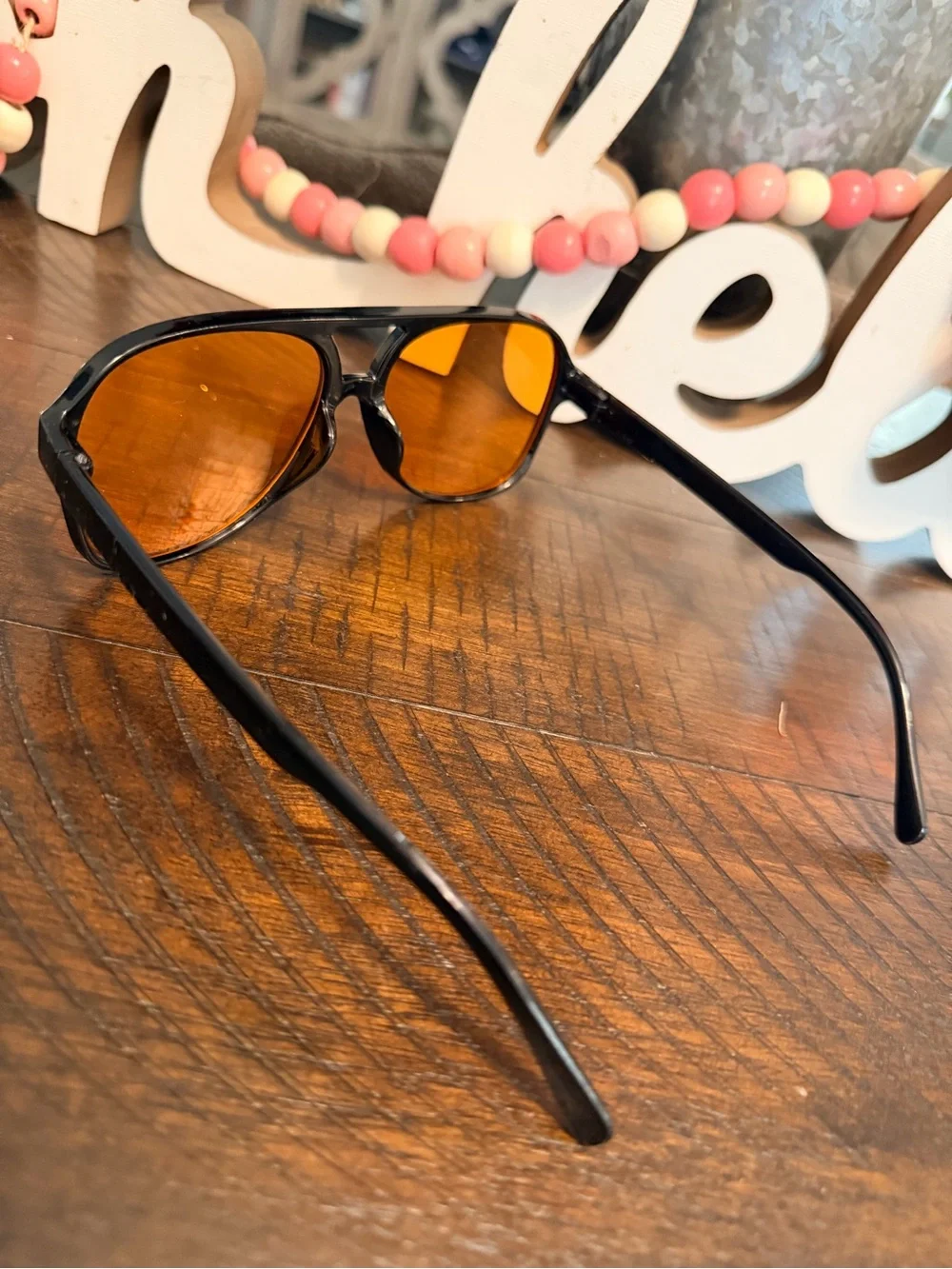 Women's Black Frame Sunglasses with Amber-Orange Lenses